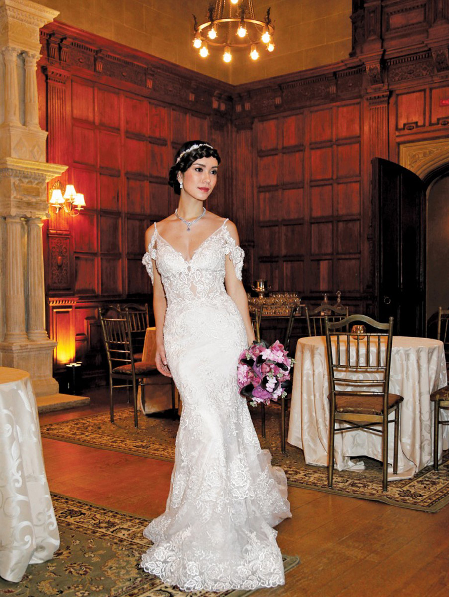 bride in wedding dress in ornate ballroom