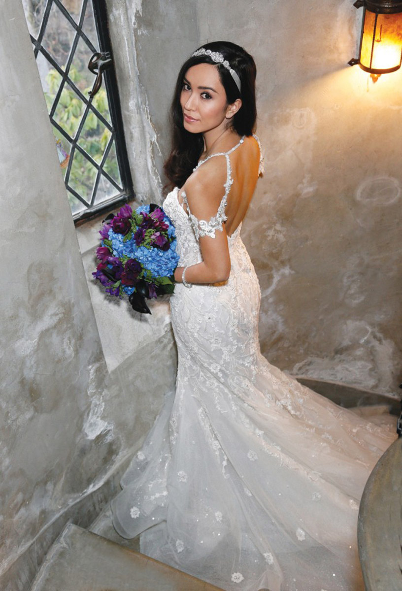 bride in wedding dress in spiral staircase