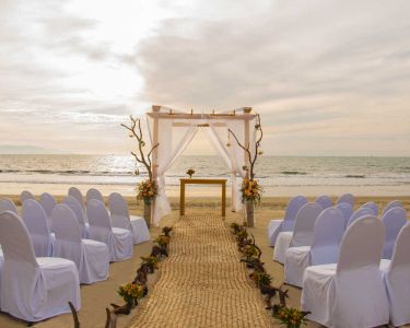 beach-wedding-arch-setup-at-sunset