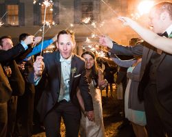 inn-send-off-wedding-bride-groom-spraklers-favors-night-outdoor-wedding-reception-party-rustic
